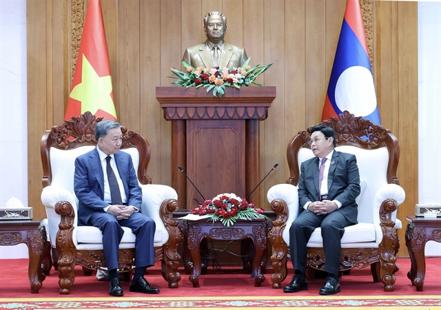 Vietnamese and Lao Leaders Reaffirm Commitment to Strengthening Bilateral Ties 1 Vietnamese and Lao