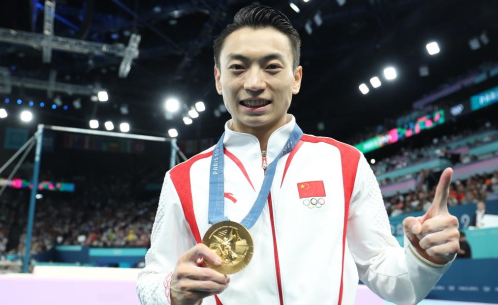 Zou Jingyuan Overcomes Shoulder Injury to Win Men's Parallel Bars Title at Paris Olympics 1 Zou Jingyuan